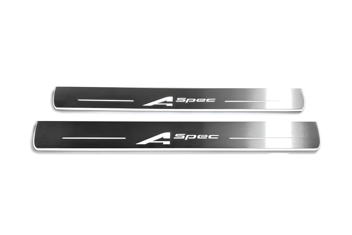 Two long silver-finished door sill plates with A-Spec lettering on a light background, straight-on view.