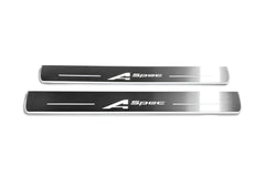 Two long silver-finished door sill plates with A-Spec lettering on a light background, straight-on view.