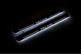 Renault Megane III 2009+ illuminated entry guards in stainless steel with Megane logo