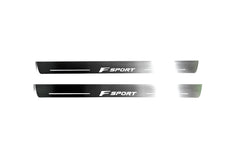 Two long silver-finished door sill plates with F Sport lettering on a light background, straight-on view.