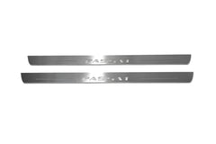 Two long silver-finished door sill plates with Passat lettering on a light background, straight-on view.