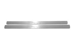 Two long silver-finished door sill plates with Targa lettering on a light background, straight-on view.