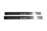 Two long silver-finished door sill plates with Maxima lettering on a light background, straight-on view.