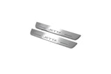 Two short silver-finished door sill plates with Jetta lettering on a light background, angled view.