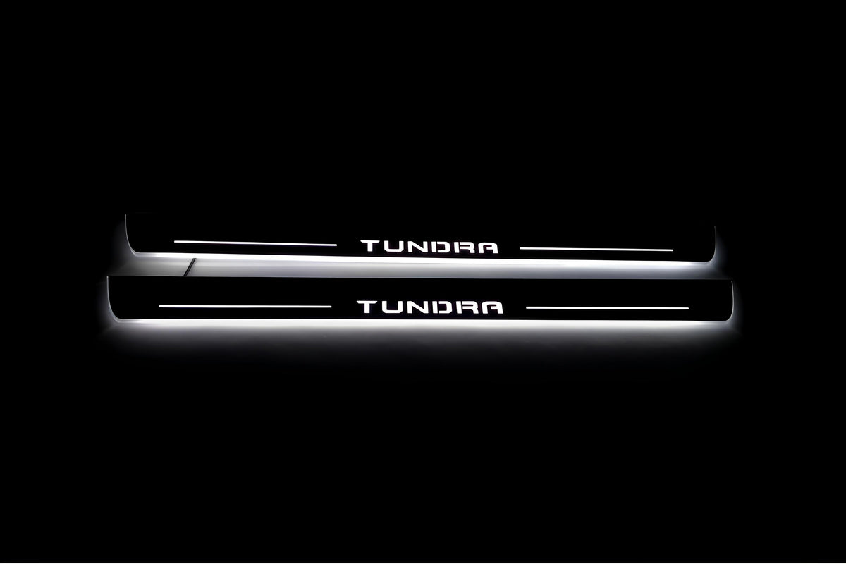 Toyota Tundra IV XK80 2022+ LED door sill plates in stainless steel with Tundra logo