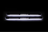 Toyota Corolla XI 2013+ entry guards in stainless steel with Corolla logo
