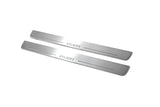 Two long silver-finished door sill plates with Aveo lettering on a light background, angled view.