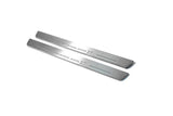 Two long silver-finished door sill plates with Grandland X lettering on a light background, angled view.