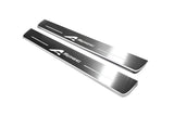 Two long silver-finished door sill plates with A-Spec lettering on a light background, angled view.