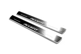 Two long silver-finished door sill plates with Accent lettering on a light background, angled view.