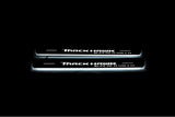 Jeep Grand Cherokee IV WK2 2010+ LED door sill plates in stainless steel with TrackHawk Supercharged logo