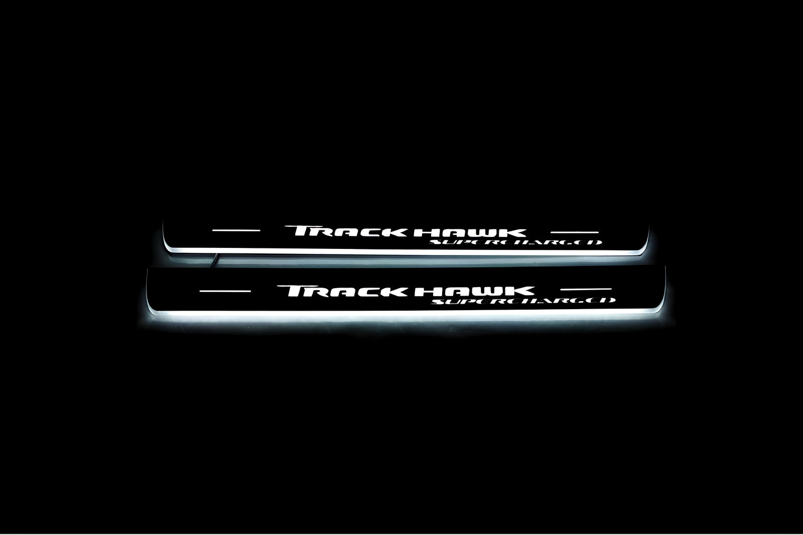 Jeep Grand Cherokee IV WK2 2010+ LED door sill plates in stainless steel with TrackHawk Supercharged logo