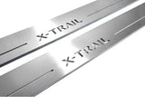 Close-up of X-Trail lettering and linear slots in silver-finished door sill plates.