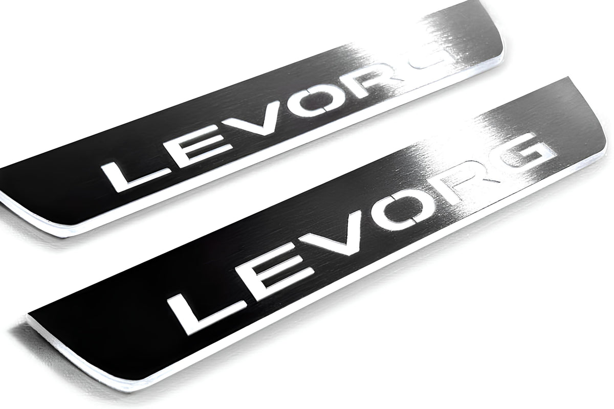 Close-up of Levorg lettering and linear slots in silver-finished door sill plates.