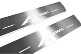 Close-up of A-Spec lettering and linear slots in silver-finished door sill plates.