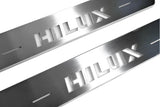 LED door sill plates for Toyota Hilux VIII 2015+ stainless steel with Hilux logo