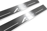 Close-up of A-Spec lettering and linear slots in silver-finished door sill plates.
