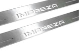 Close-up of Impreza lettering and linear slots in silver-finished door sill plates.