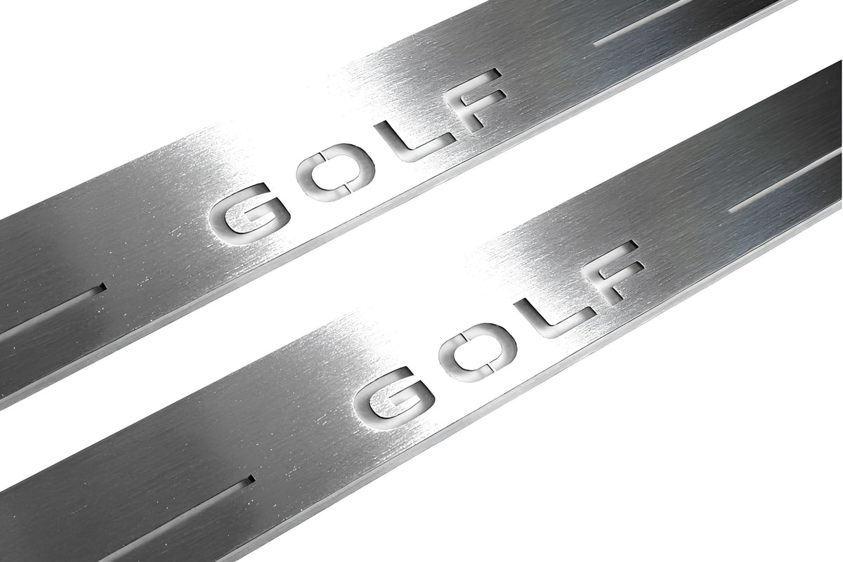 Close-up of Golf lettering and linear slots in silver-finished door sill plates.