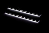 Two long door sill plates with Passat lettering and edges illuminated in white, angled view on a dark background.