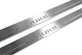 Close-up of Juke lettering and linear slots in silver-finished door sill plates.
