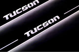 Hyundai Tucson I 2004+ LED door sill plates in stainless steel with Tucson logo