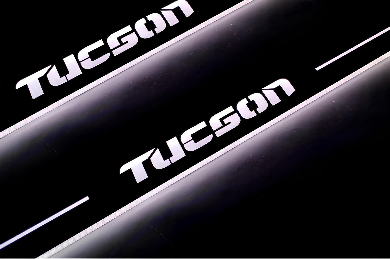 Hyundai Tucson I 2004+ LED door sill plates in stainless steel with Tucson logo