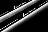 Close-up of Lanos lettering and illuminated edges on door sill plates against a dark background.