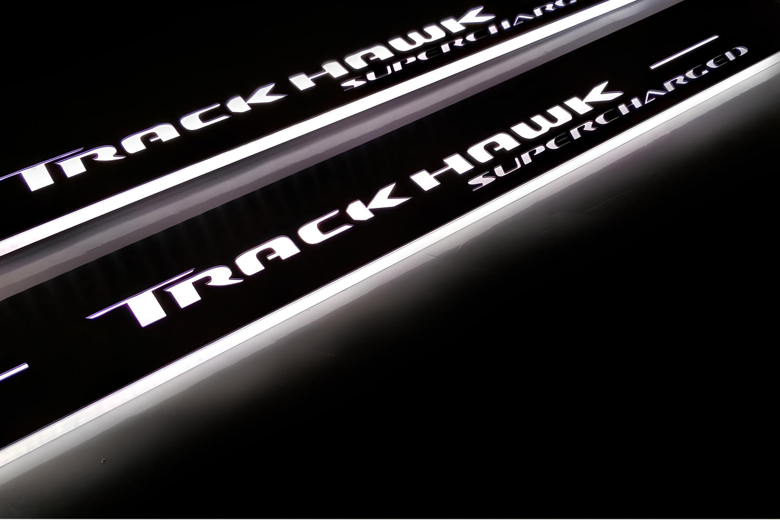 LED door sill plates Jeep Grand Cherokee IV WK2 2010+ stainless steel with TrackHawk Supercharged logo