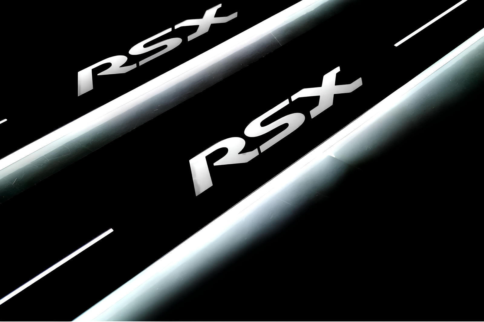 Acura RSX 2002+ entry guards in stainless steel with RSX logo
