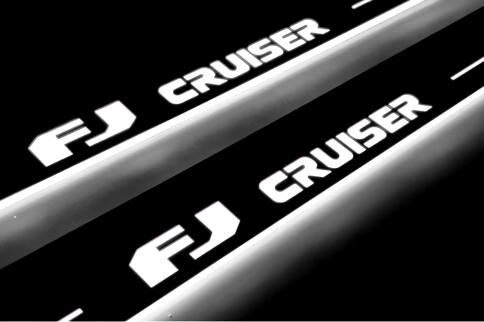 Toyota FJ Cruiser J15 2006+ door sill plates in stainless steel with FJ Cruiser logo
