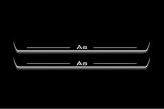 Two long door sill plates with A6 lettering and edges illuminated in white, straight-on view on a dark background.