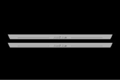 Catalog illustration of two long gray door sill plates with Audi A6 lettering on a black background.