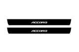 Catalog illustration of two black front door sill plates with Accord lettering.