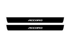 Catalog illustration of two black front door sill plates with Accord lettering.