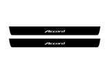 Catalog illustration of two black front door sill plates with Accord lettering.