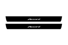 Catalog illustration of two black front door sill plates with Accord lettering.