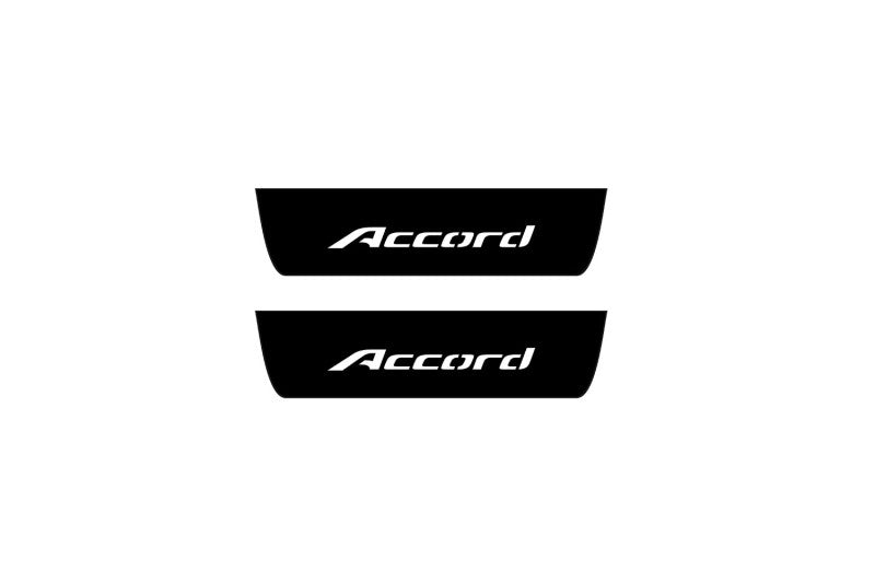 Catalog illustration of two black rear door sill plates with Accord lettering.