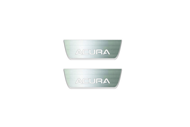 Two short silver-finished door sill plates with Acura lettering on a light background, straight-on view.