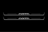 Two long door sill plates with Adam lettering and edges illuminated in white, straight-on view on a dark background.