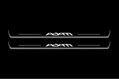 Two long door sill plates with Adam lettering and edges illuminated in white, straight-on view on a dark background.