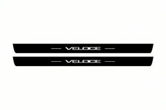 Catalogue illustration of two front black Matte PRO LED door sill plates with illuminated Veloce lettering for Alfa Romeo Giulia; dimensions are selected during manufacture.