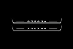 Two long door sill plates with Arkana lettering and edges illuminated in white, straight-on view on a dark background.
