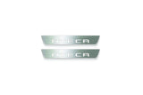 Two short silver-finished door sill plates with Ateca lettering on a light background, straight-on view.
