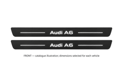 Matte PRO catalogue illustration showing two FRONT plates with illuminated Audi A6 lettering on a white background; Audi A6 Avant 4G dimensions are selected during manufacture; rear plates are not pictured.