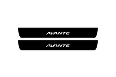 Catalog illustration of two black front door sill plates with Avante lettering.