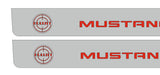Close-up catalog illustration of red Mustang lettering and a Bullitt target emblem on gray door sill plates.