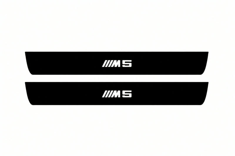 Catalogue illustration of two front black Matte PRO LED door sill plates with illuminated M5 lettering for BMW 5 E61; dimensions are selected during manufacture.