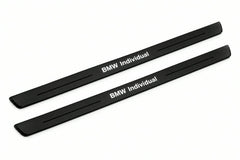 Catalogue illustration of two front black Matte PRO LED door sill plates with illuminated BMW Individual lettering for BMW X5 E53; dimensions are selected during manufacture.