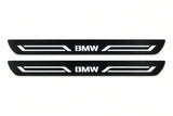 Catalogue illustration of two front black Matte PRO LED door sill plates with illuminated BMW LINE lettering for BMW X5 E70; dimensions are selected during manufacture.